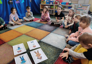Dzieci oglądają ilustracje, udzielaja odpowiedzi w jaki sposób te osoby nas chronią.
