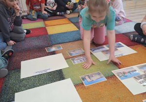 Dzieci przyporządkowują budynki do odpowiedniej kategorii.